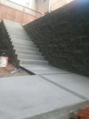 a stone staircase with a brick wall