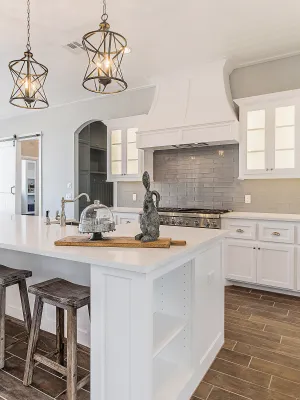 a kitchen with white cabinets