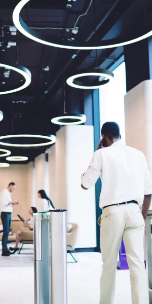 a woman and a man walking down a hallway