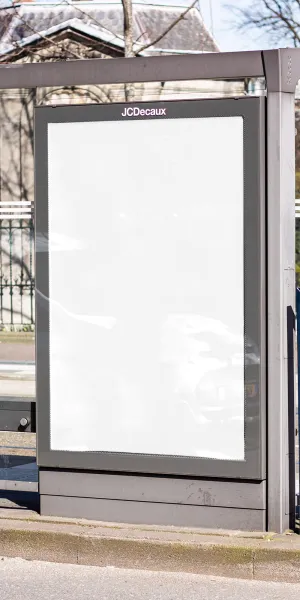 a large white sign on a fence