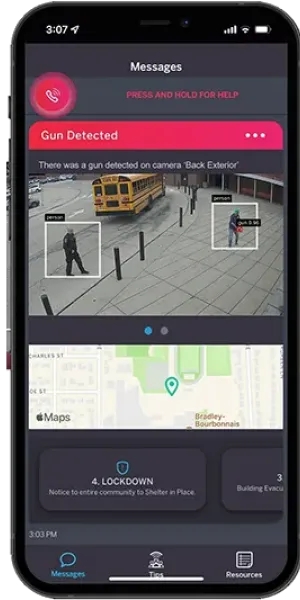 Smartphone screen showing gun detection alert on surveillance camera with lockdown notice and location map.