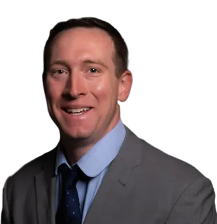 a man in a suit smiling