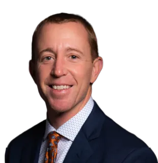 a man in a suit smiling