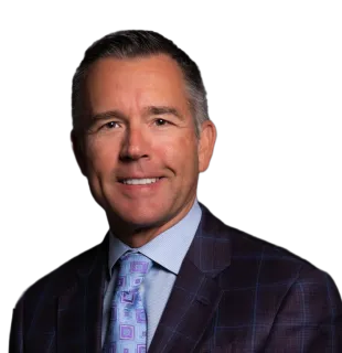 a man in a suit smiling