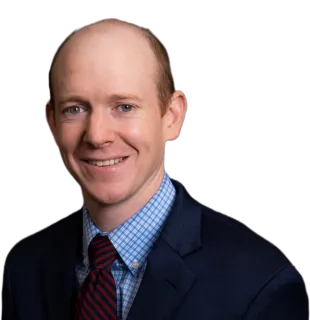a man wearing a white shirt and red tie