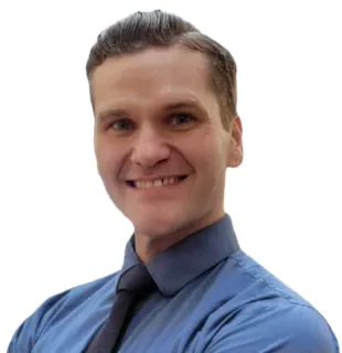 a man wearing a blue shirt and tie