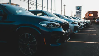 a row of cars parked in a parking lot