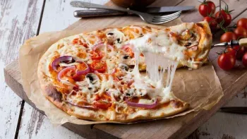 a pizza with tomatoes and cheese