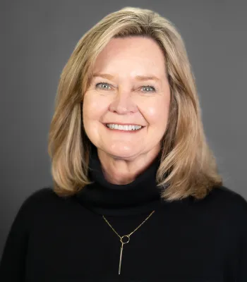 a woman smiling for the camera