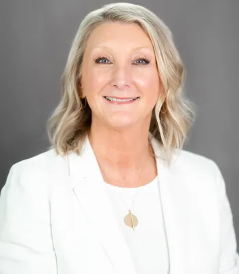 a woman wearing a white coat