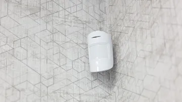 a white device on a white tiled surface
