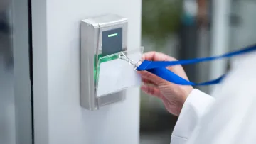 a hand holding a blue cable