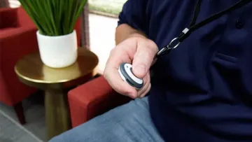 a person holding a panic button