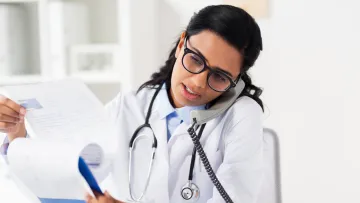 a doctor holding a clipboard