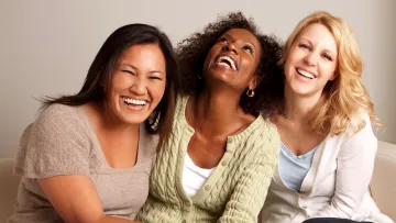 a group of women smiling