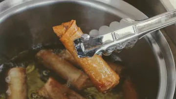 a fork in a pot of food