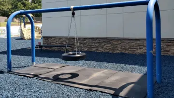 a swing set on a trampoline