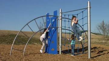 a person and a child playing on a playground