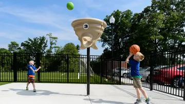 kids playing basketball on a court
