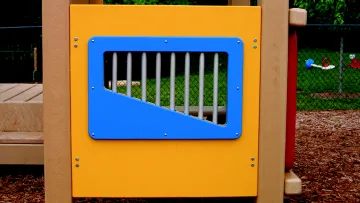 a blue and yellow playground slide