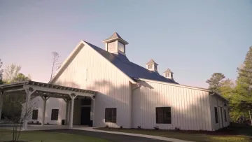 a white house with a black roof