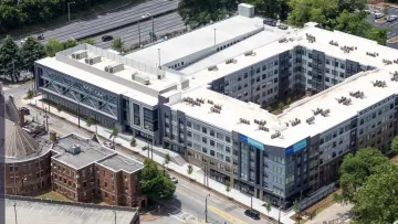 a large building with a parking lot