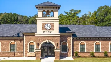 a large brick building with a clock tower