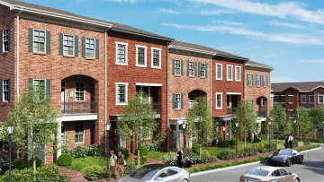 a brick building with cars parked in front of it