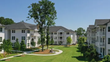 a large building with trees in front of it