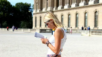 a woman looking at a book