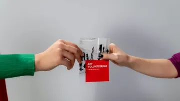 a person holding a card