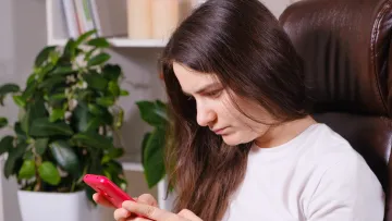 a woman looking at her phone