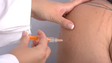 a person receiving an injection