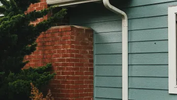 a house with a metal pipe