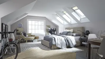 a bedroom with skylights