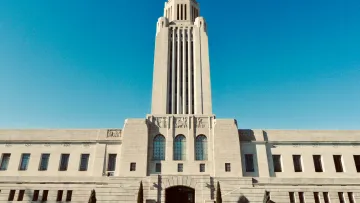 a large white building with Nebraska State Capitol