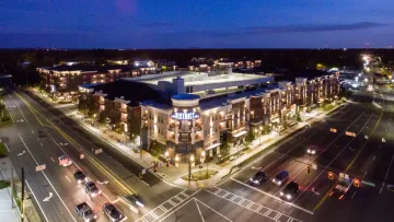 a large building with a parking lot