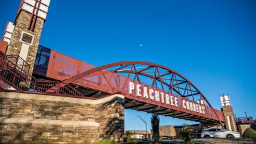 a red bridge with a white sign