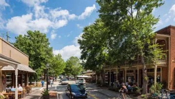 a street with cars and people on it