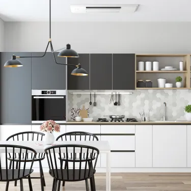 a kitchen with a table and chairs