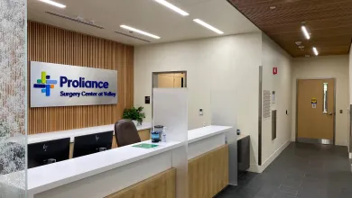 a room with a counter and chairs