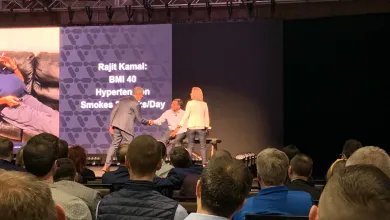 a group of people sitting in front of a crowd