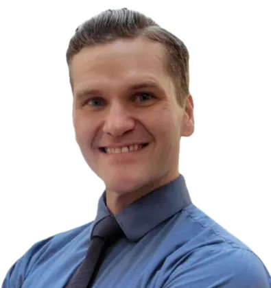 a man wearing a blue shirt and tie