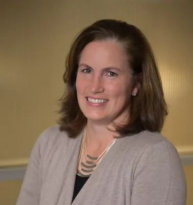 a woman smiling at the camera