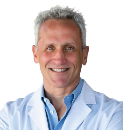 Smiling middle-aged male doctor with gray hair wearing a white coat and light blue shirt against a clear background