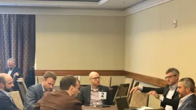 a group of people sitting at a table