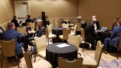 a group of people sitting at a table in a room