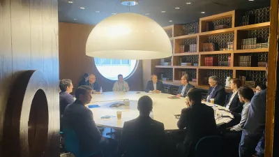 a group of people sitting around a table