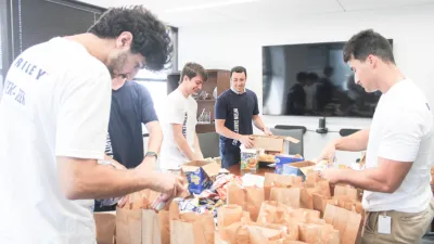 a group of men in a room with boxes