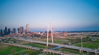a city skyline with a bridge